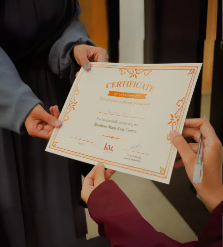 ceo khudmukhtaar awarding certificate to a student